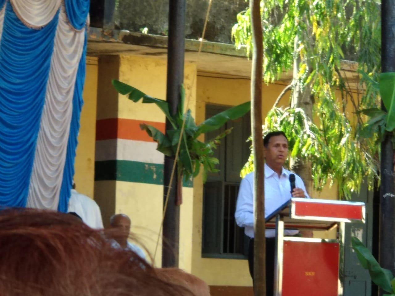 A speaker addressing the gathering from a podium