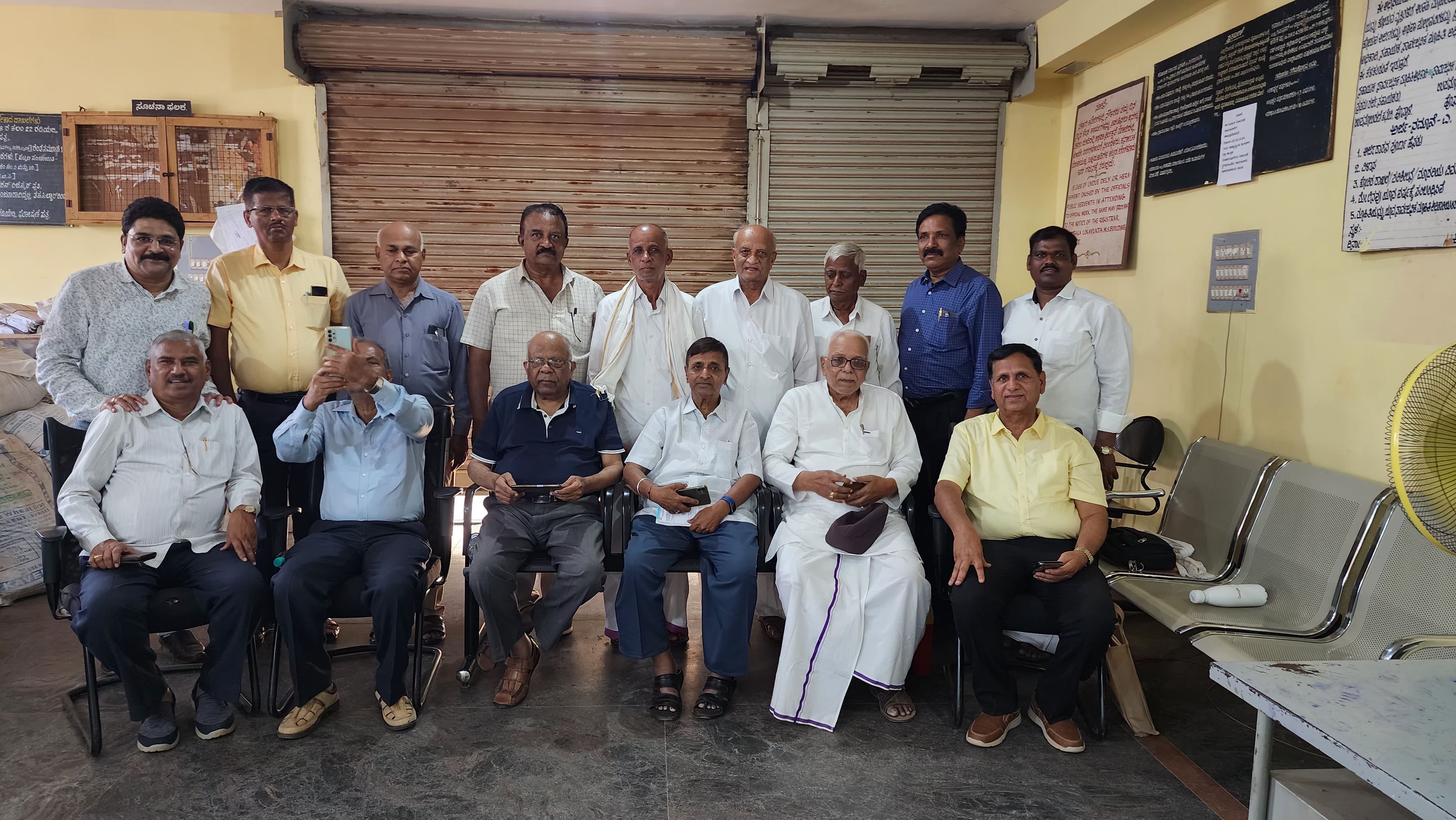 Group photo of trustees, some seated and some standing